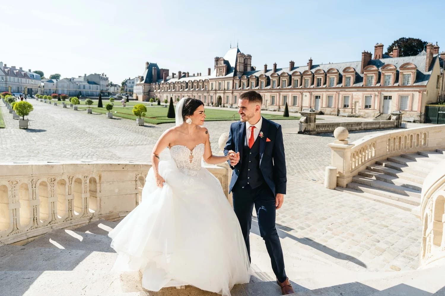 Bride and groom wedding photo session on the grand staircase of Chateau de Fontainebleau near Paris by SabShots